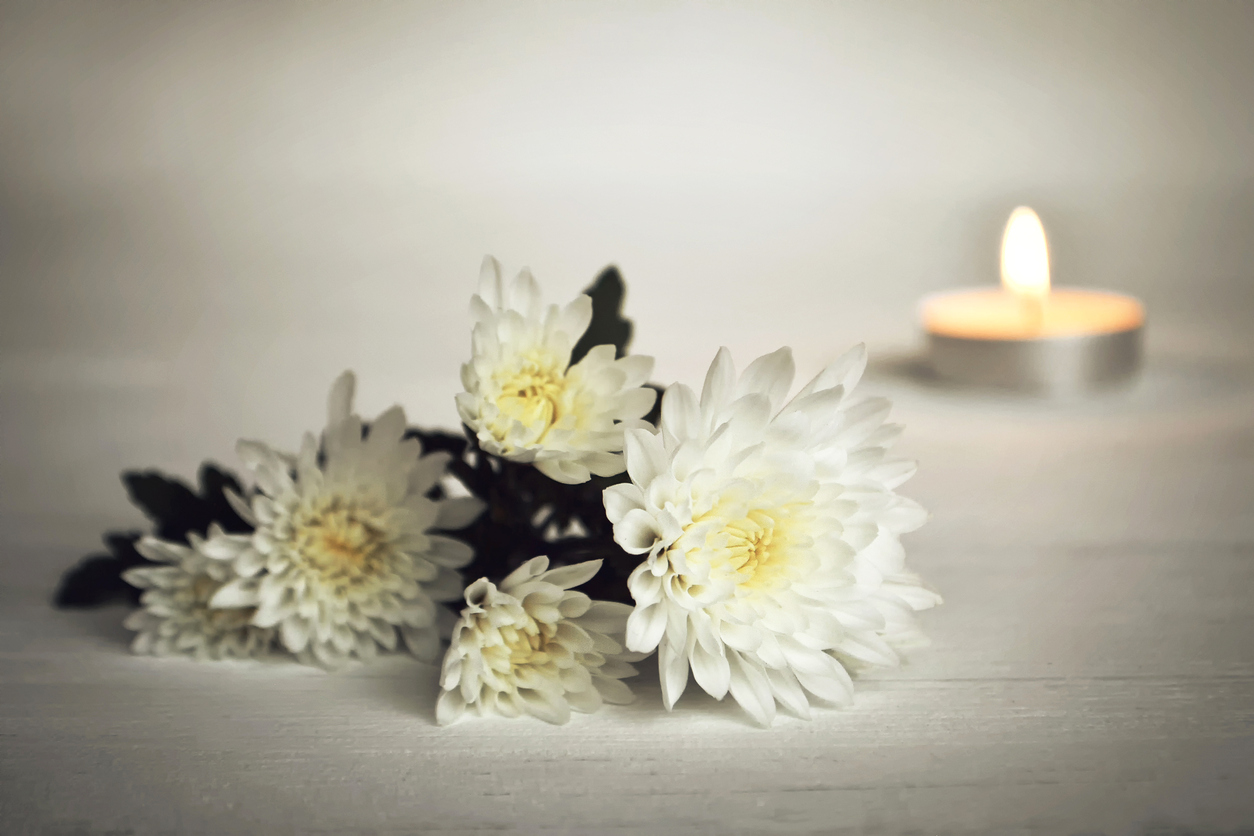 Candle and white flowers
